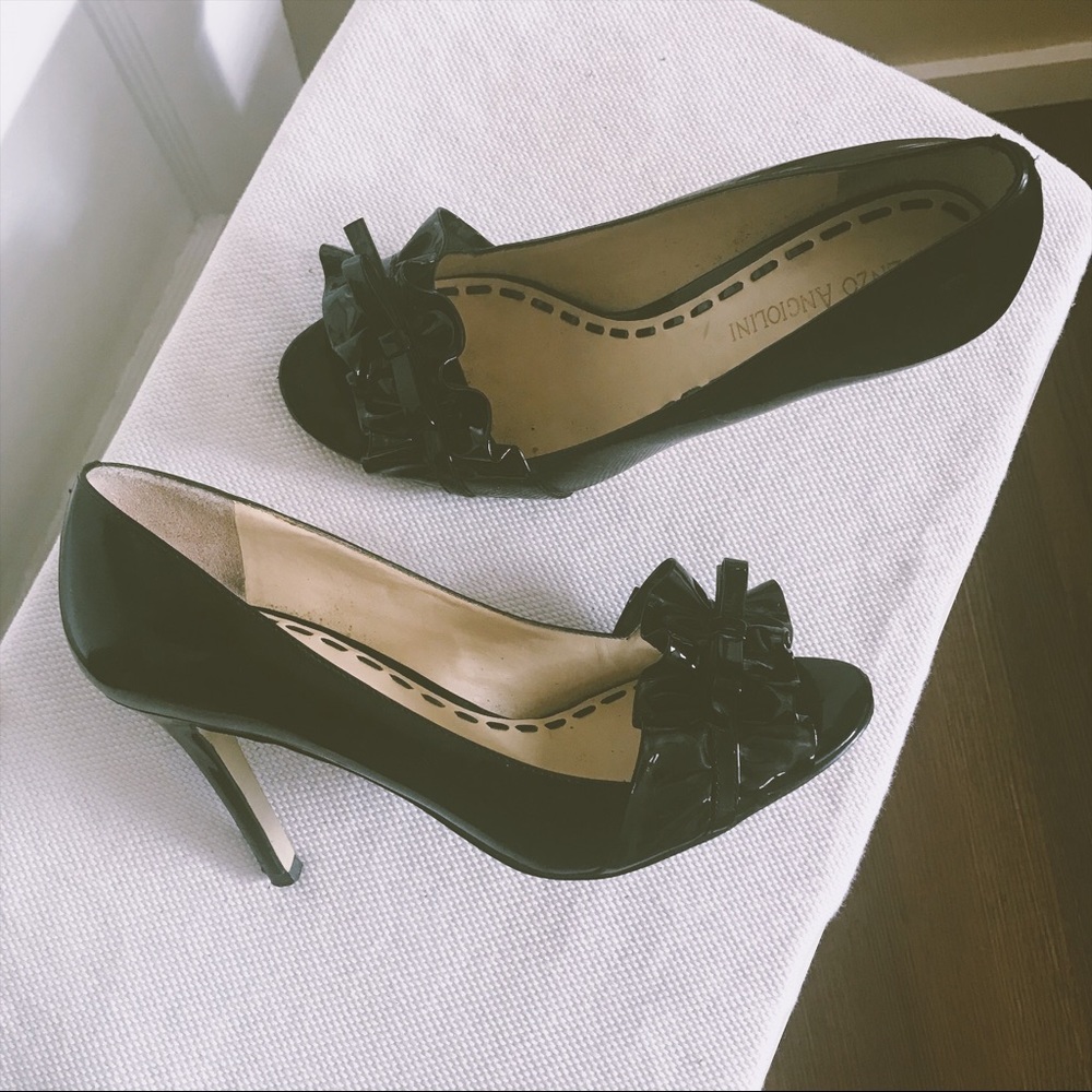 Black patent leather peep toe pumps